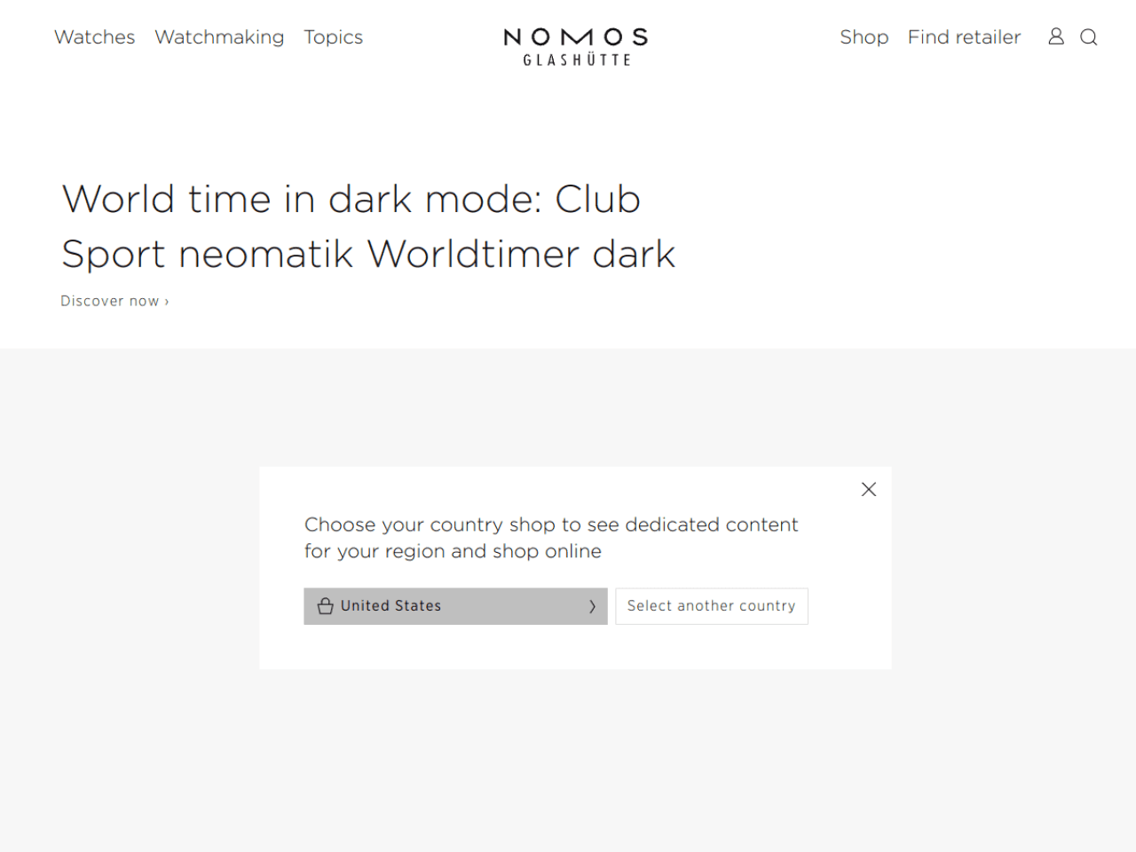 NOMOS Glashütte 웹사이트 데스크톱 화면 스크린샷 — 미니멀, 타이포그래피 스타일